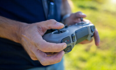 Drone pilot controlling flight with modern remote controller © Antonio Gravante