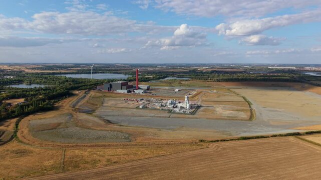 Aerial view of Rookery South ERF and Millbrook Power plant with industrial buildings and surrounding fields in Stewartby, England, United Kingdom.