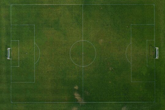 Aerial view of a green soccer field with white markings and goalposts in Boulder, Colorado, United States.