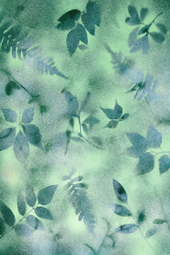 Handmade botanical art print on sage green paper, with misty leaf silhouettes and soft airbrush grain. Drops into a minimal wellness and spa brand identity composition with copy space.