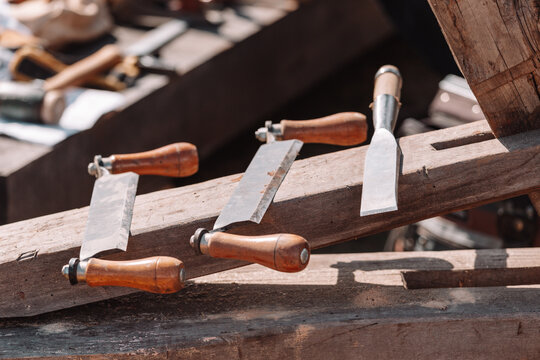 Traditional Woodworking Hand Tools with Wooden Clamps and Chisel