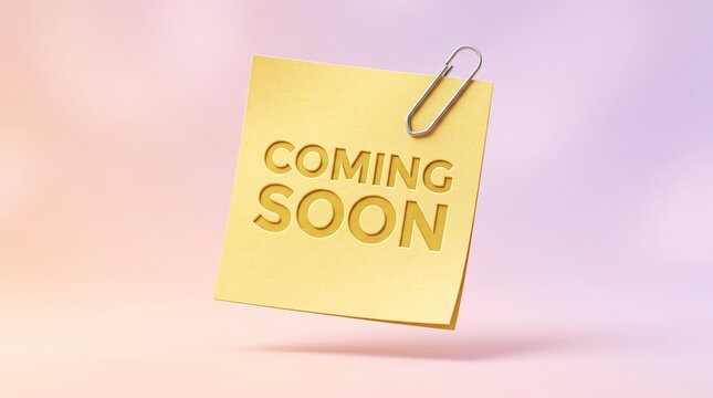 Yellow sticky note with coming soon text and paper on soft blurred background launch date business promotion office supply post it blank space reminder tag