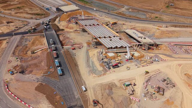 Aerial view of Black Cat Roundabout construction showing earthworks, heavy machinery, and ongoing civil engineering progress in Chawston, England, United Kingdom.