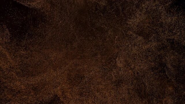 Close up view of dark brown textured stone surface.