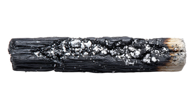 Burnt matchstick lying horizontally on white background