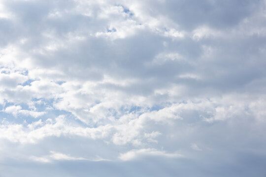 Blue sky with large white and gray clouds in daylight with copy space