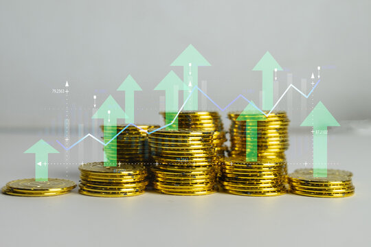 Stacks of gold coins with digital upward arrows and financial graph overlay idea for investment growth,,financial concept.