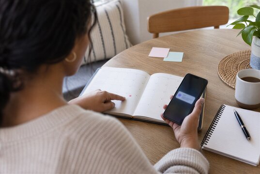 Adult woman with ADHD deeply focused on detailed creative work at desk, concept of hyperfocus, intense concentration, attention regulation, forgotten break and executive dysfunction
