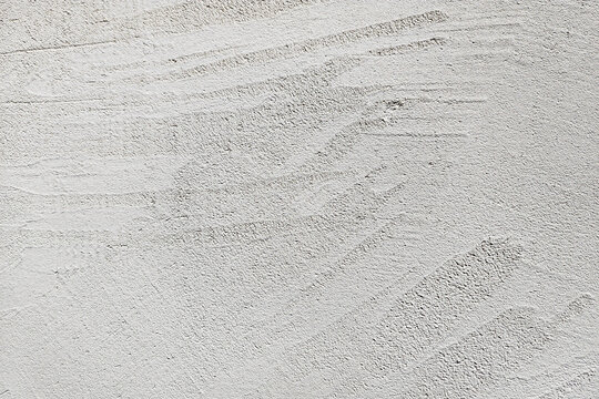 Light gray concrete plaster texture wall surface horizontal background with trowel strokes for architectural rendering interior design overlay construction banner