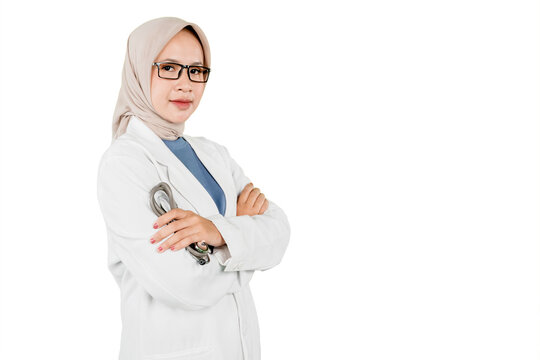 Confident Asian Muslim Female Doctor Standing with Arms Crossed Holding Stethoscope