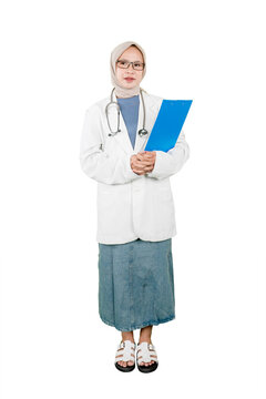 Full Body Asian Muslim Female Doctor Holding Clipboard Standing Against White Background