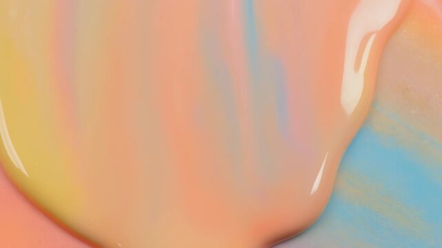 溶けて広がるパステルカラーのクレヨンの抽象背景