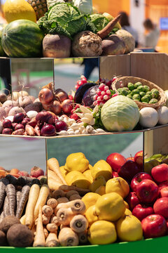 Assortment Of Fresh Vegetables And Fruits Displayed On Shelves For Sale At A Market Or Grocery Store Promoting Healthy Eating