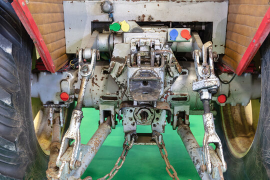 Rear View Of A Gray Tractor With Hitch And Tires For Agriculture And Farming Equipment Showing Mechanical Parts And Connections