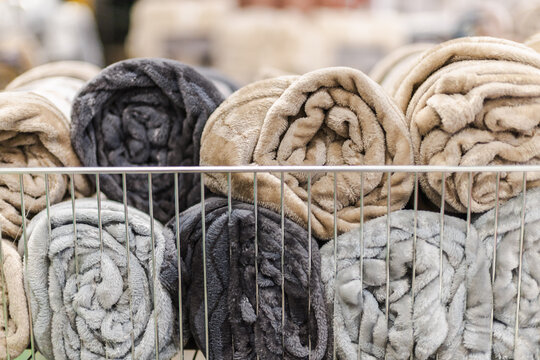 Rolled Plush Blankets in Retail Display Basket