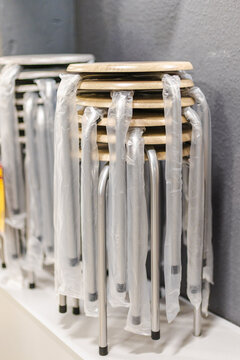 Stacked Folding Chairs in Protective Plastic at Home Improvement Store