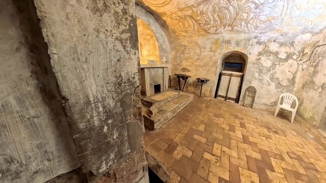 Ancient medieval crypt of the Basilica of Sant'Elia in Castel Sant'Elia with Romanesque stone columns, cross vaults, and historic tombs, Viterbo, Lazio, Italy