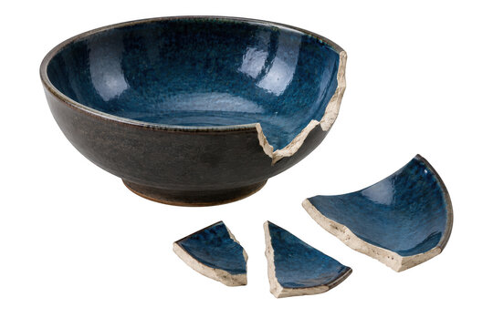 Broken blue ceramic bowl with scattered shards isolated on transparent