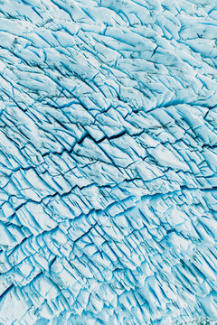 View of the deep blue crevasses and jagged ice formations of the Perito Moreno Glacier in El Calafate, Santa Cruz Province, Argentina.