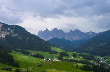 Obraz premium Landscape village Santa Maddalena in mountain valley at sunset in Dolomites, Italy. St. Magdalena and mountains. Val di Funes 
