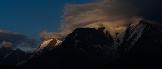Obraz premium Summer view of the Mont Blanc massif above forested slopes 