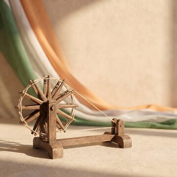 A wooden charkha spinning wheel symbol of Mahatma Gandhi against an Indian flag background with soft sunlight for Gandhi Jayanthi celebration and patriotism.
