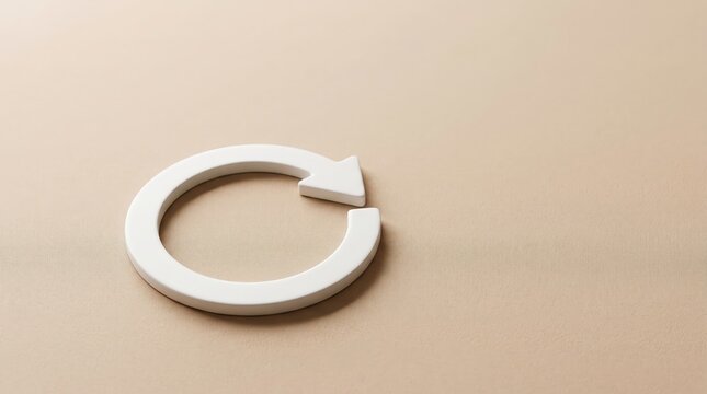 Recycle symbol rests on a neutral tan background providing ample space for text and professional branding applications.