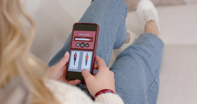 Seeing red jacket, adult female tapping, pinching phone and zooming to inspect for purchase at home