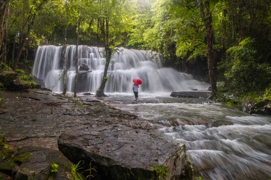 The beauty of Pang Sida Waterfall with water cascading across the entire width of the falls at Pang Sida National Park, Sa Kaeo Province, Thailand.