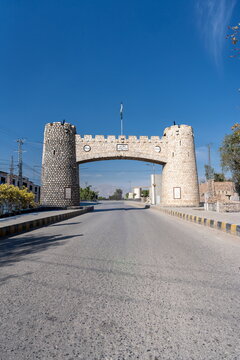 View of the historic stone archway of the Khyber Pass with its two towers under a clear blue sky in Khyber District, Khyber Pakhtunkhwa, Pakistan.