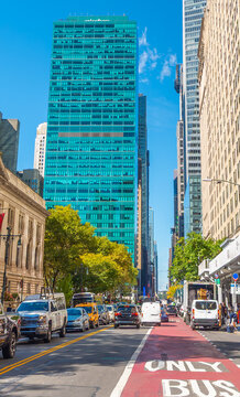 Bus Only lane in Manhattan with traffic and skyscrapers