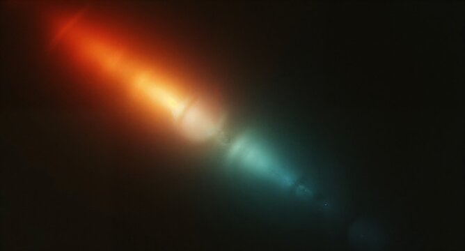 Abstract light flare with orange and blue gradient on a dark background