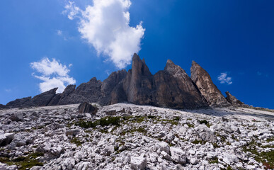 Obraz premium Mountain landscape panorama Tre Cime Mount against a blue summer background. 