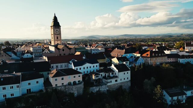 Sunny drone footage of the historical town Enns in Austria during sunset