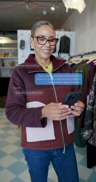 Senior Woman in Clothes Store and Looking at Phone