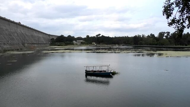 An isolated boat parked in the lake near Brindavan Gardens, Mysore, Karnataka, India