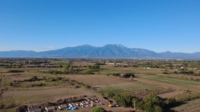 Aerial view of Mount Olympus and the rural landscape near Paralia Katerinis, Pieria, Greece.