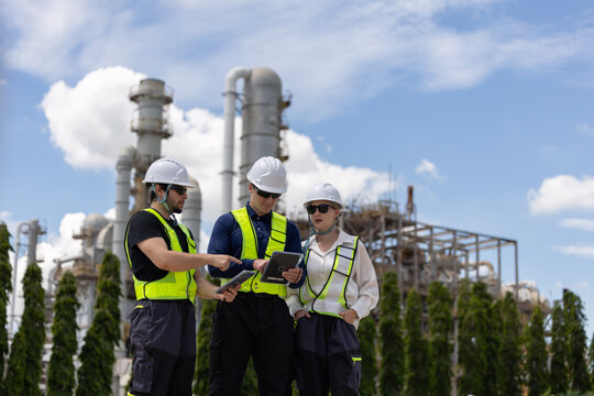 Group of petroleum engineers having a discussion at the site