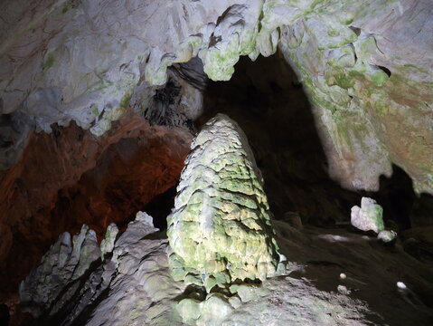 View of Vrelo Cave featuring a large, textured stalagmite formation illuminated within the cavern, showcasing limestone details in Matka, Komuna e Sopishtes, North Macedonia.