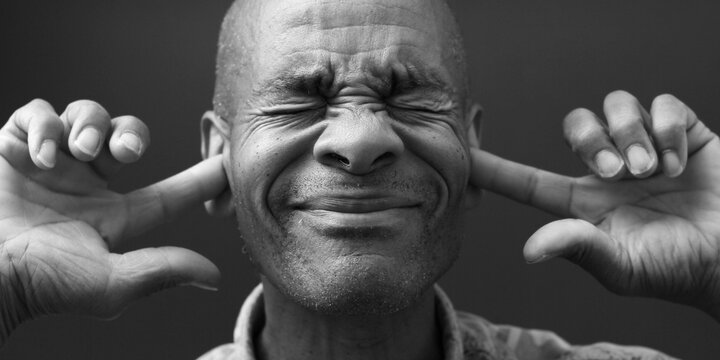 A person using sign language and communicating expressive emotions through visual gestures, highlighting themes of Deaf culture, accessibility, and inclusion in high-quality stock photo stock images