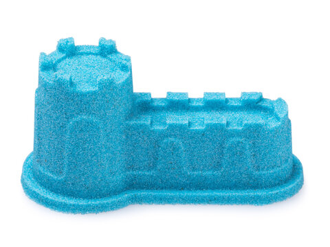 Blue kinetic sand castle tower fortress isolated on white background, studio shot