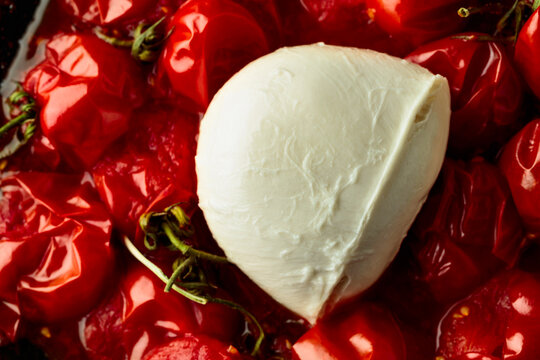 Mozzarella and roasted red cherry tomatoes.