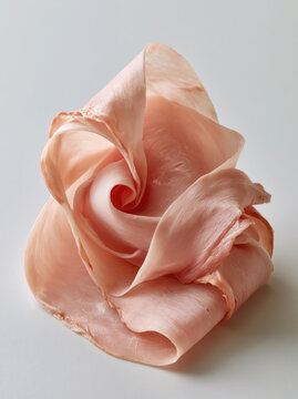 Delicate ham slice pink meat cured pork food art abstract food gourmet texture minimal background closeup detail soft lighting studio shot Delicate ham slice pink meat cured pork food art abstract