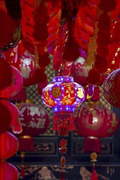 Chinese red hanging lanterns, as offerings, donations and good luck symbols in Wat Mangkon, an important Sino-Thai temple, Chinatown, Bangkok, Thailand