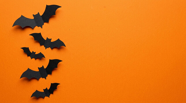 Halloween Bat Decorations on Orange Background