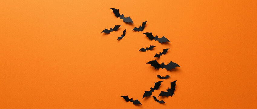 Halloween Bat Swarm on Orange Background