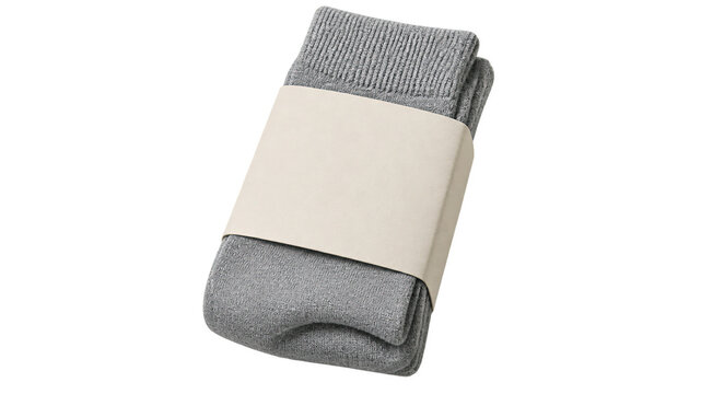 Pair of folded gray ribbed knit socks wrapped in a plain cream paper band, shown from above as an isolated apparel packaging product cutout on transparent background.
