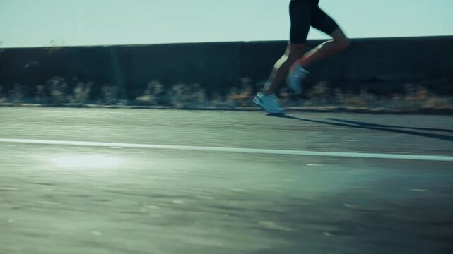 Runner Participating In Marathon. Running Fast Along An Asphalt Road. Sprint