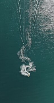 Aerial view of man riding jet ski on Baltic sea.