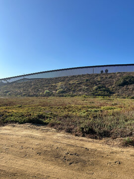 US Mexico Border Wall Near Tijuana Slough in Southern California